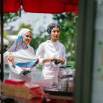Two muslim women buying street food photo by mentatdgt via pexels cc