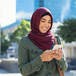 Islamic Woman In Hijab Using Phone