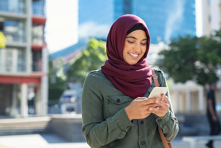Islamic Woman In Hijab Using Phone